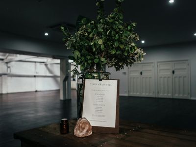 Clean and minimalist yoga space with soft lighting