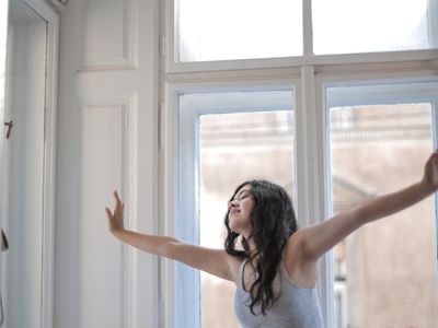 Morning stretching near a bright window