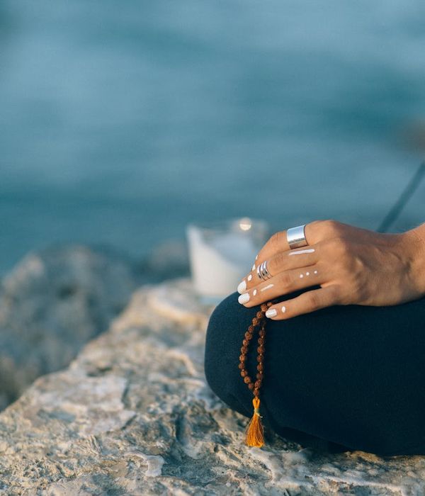 Person practicing mindful movement and deep breathing in nature